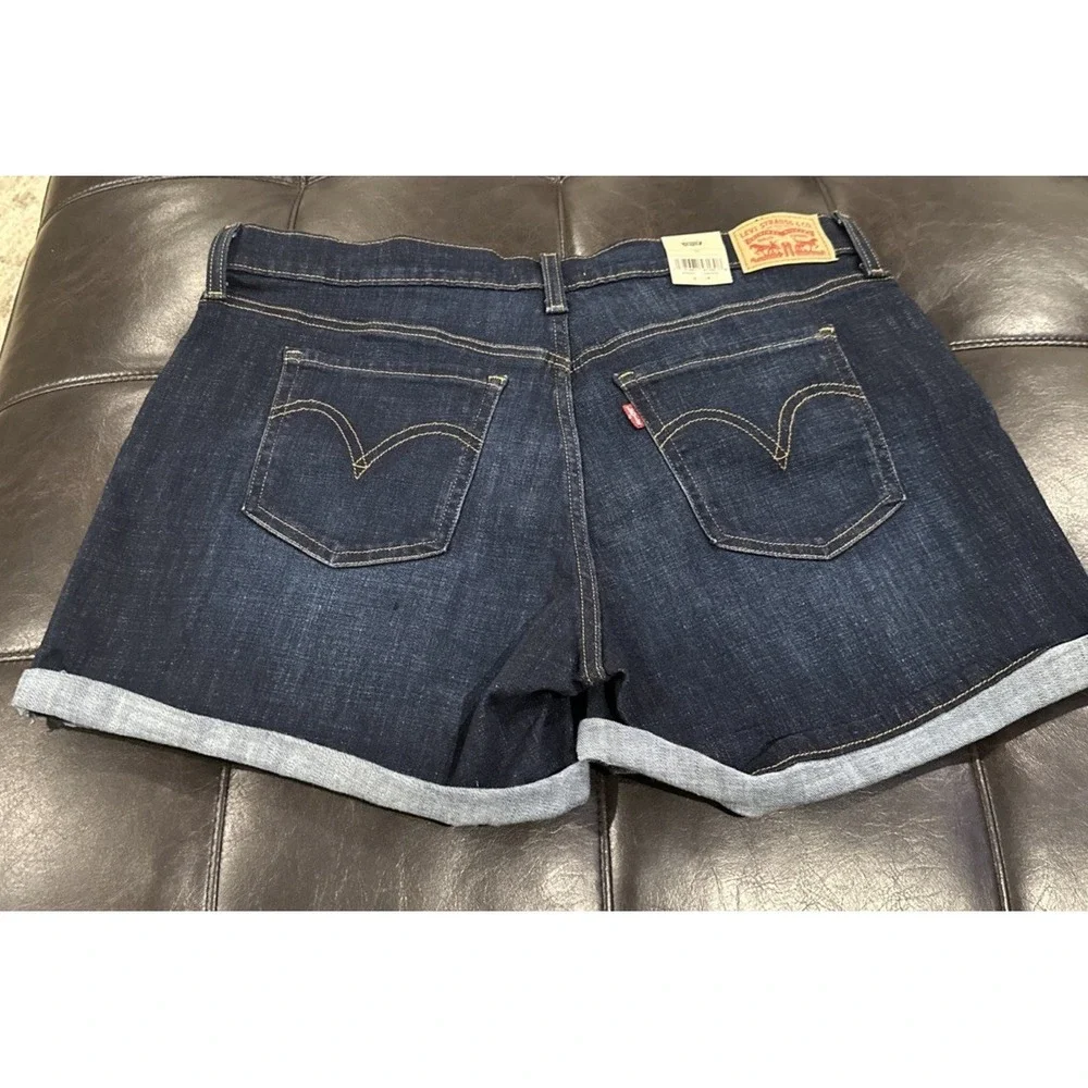 Levi's Women Size 33 Mid Length Blue Denim Shorts Cuffed Dark Distressed Stretch